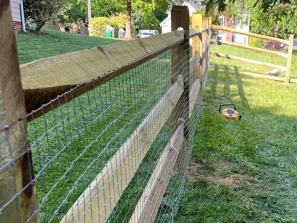 Fence with Farming Wood Post and Rail with Wire Mesh Fence in Mooresville North Carolina in Charlotte Metro Area
